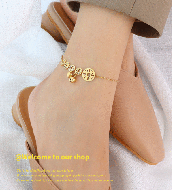 Bell pendant connected to copper coin anklet